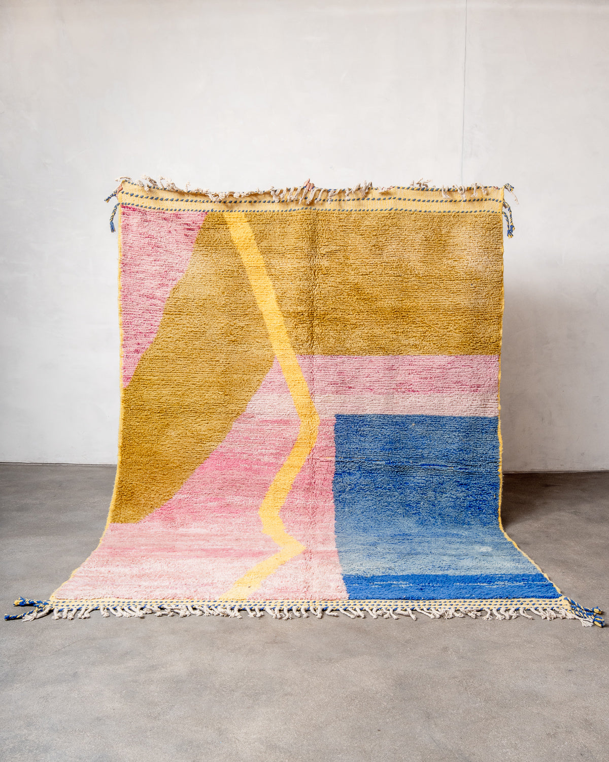 Modern, designer, handcrafted Berber rug from Morocco. Beniourain carpet with beautiful colours and patterns and fluffy wool texture.